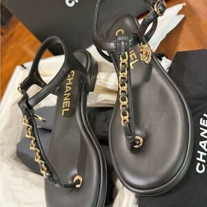 CHANEL Women's Sandals in Black with Gold Chain